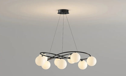 Black frame LED Chandelier with spherical bulbs turned on, designed for modern ceiling lighting in living or dining spaces.