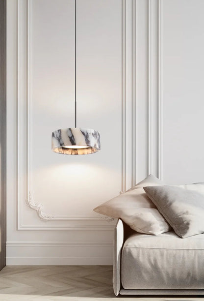 Black Marble Dome Pendant - LED Lamp hanging in a minimalist living room, enhancing the space with soft lighting and marble elegance.
