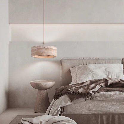 Travertine Retro Pendant Light hanging in a minimalist bedroom, enhancing the serene decor with soft LED illumination and natural stone texture.
