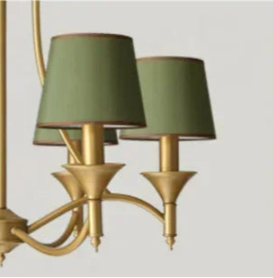 Close-up of green fabric shades on European retro chandelier with gold iron arms, showcasing vintage elegance for home lighting.
