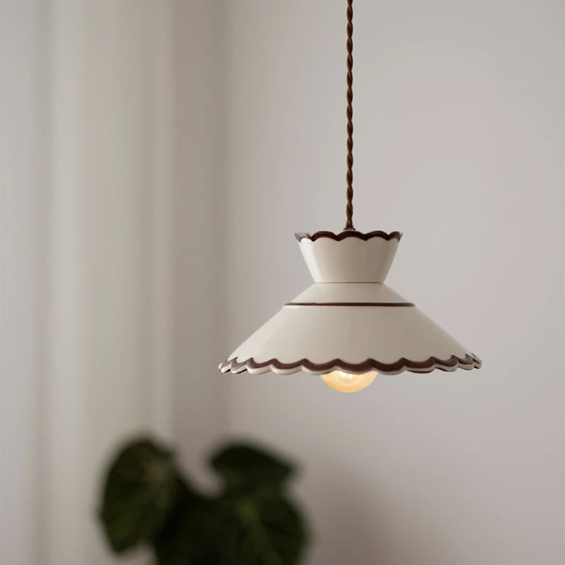 Scalloped-edge ceramic pendant lamp in white with LED bulb, ideal for vintage-inspired home lighting decor.