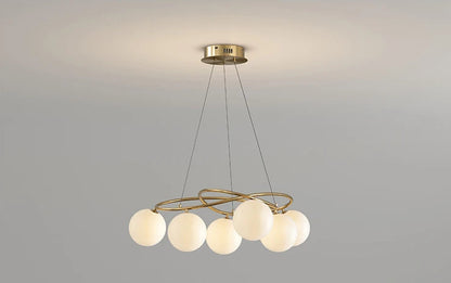 Turned-on LED Chandelier in gold finish with globe bulbs, offering warm light and modern elegance for home interiors.