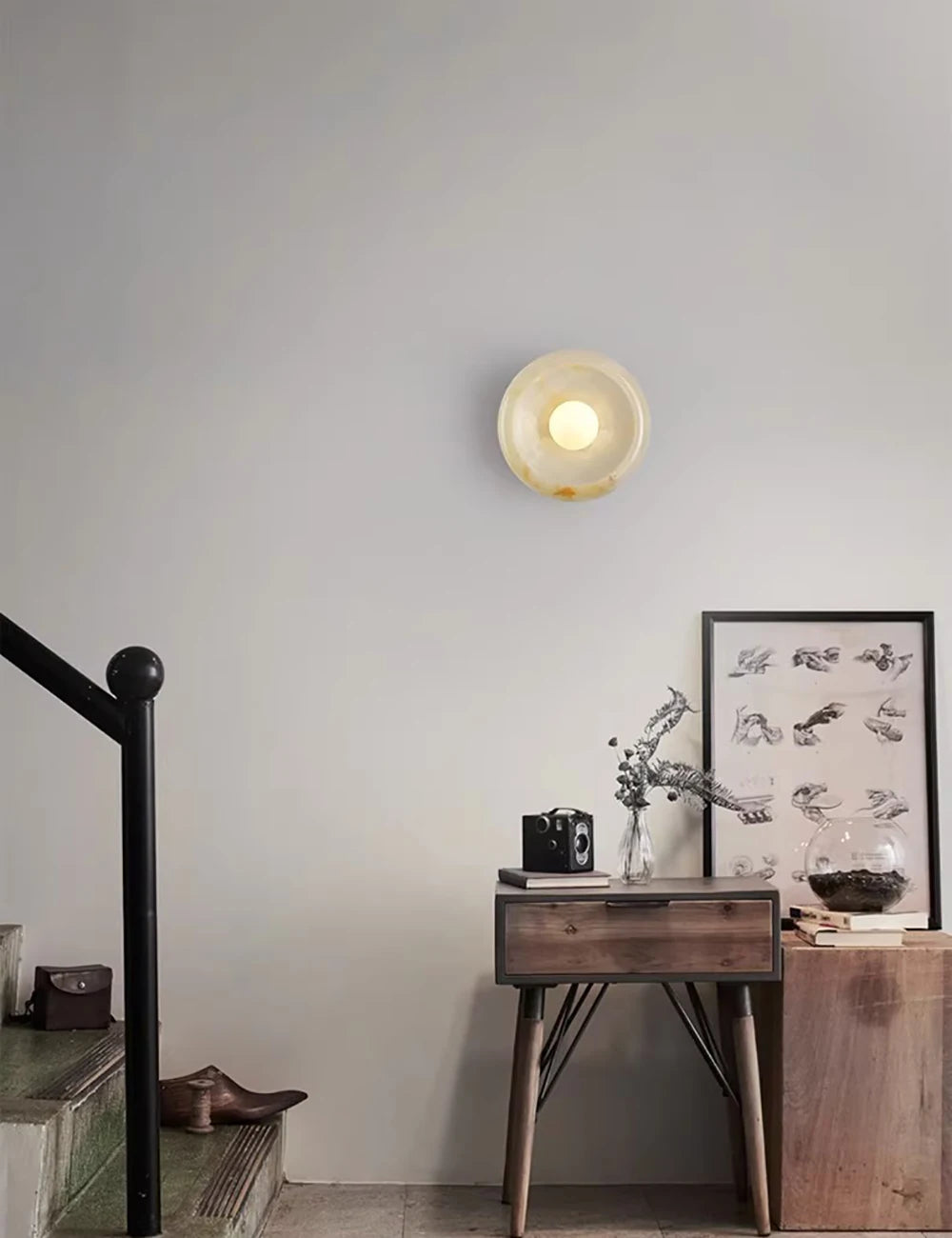 Cream-colored Jade Wall Lamp above a rustic console table, enhancing hallway decor with soft LED lighting and natural stone texture.
