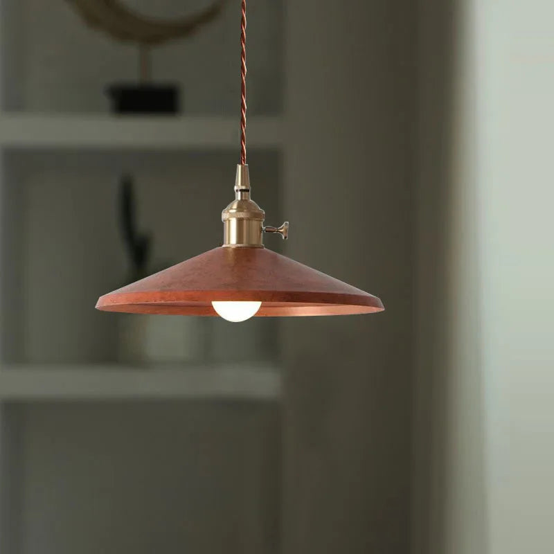 Industrial Brass Pendant Light in rustic copper finish with vintage bulb, ideal for retro-themed cafés and restaurants.