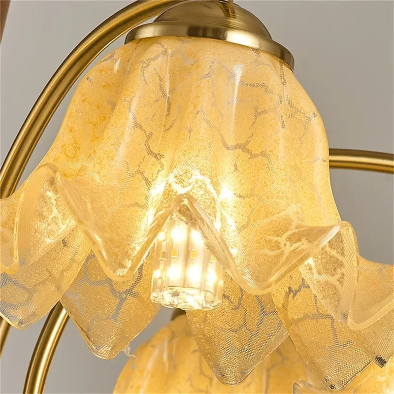 Detailed view of floral glass shade and LED bulb on American Retro Pendant Light, highlighting intricate texture and warm lighting.