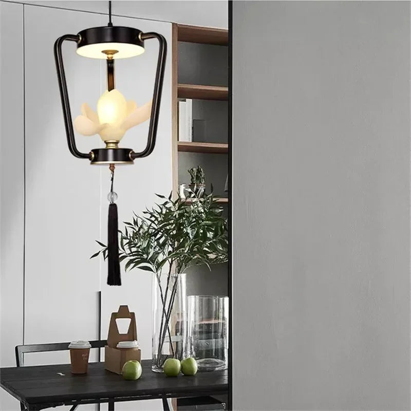 Single-light Magnolia Flower Pendant Lamp in black with LED bulb, perfect for minimalist dining or kitchen corner lighting.