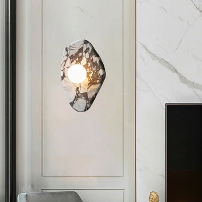 G9 Glass Ball Sconce mounted on a marble wall panel, enhancing hallway lighting with a natural stone aesthetic.