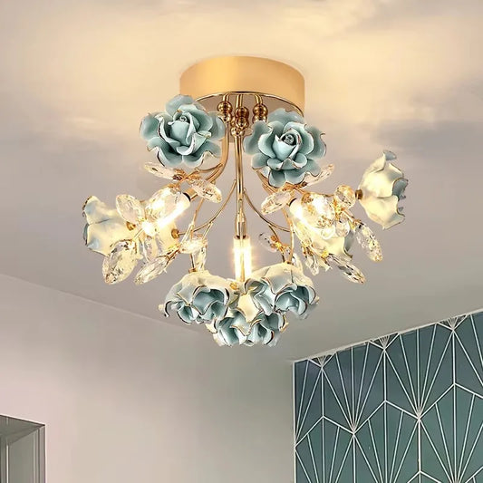 Vintage crystal rose chandelier with blue ceramic roses and LED lighting, ideal for elegant home interiors in the Lighting Fixtures category.