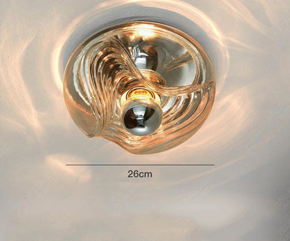 Cognac-colored designer glass wall lamp with LED light, 26cm wide, ideal for warm-toned modern interiors.