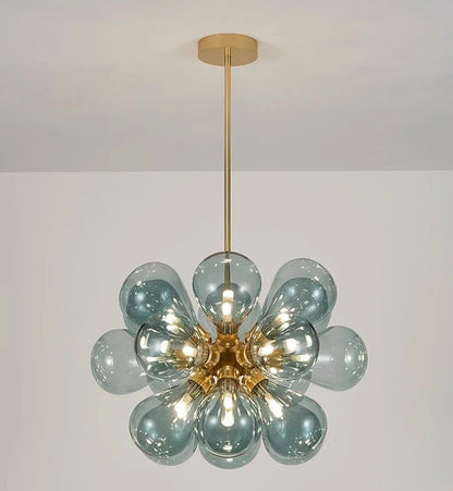 Blue bubble glass chandelier with golden lampbody, showcasing a Nordic design ideal for stylish ceiling lighting.