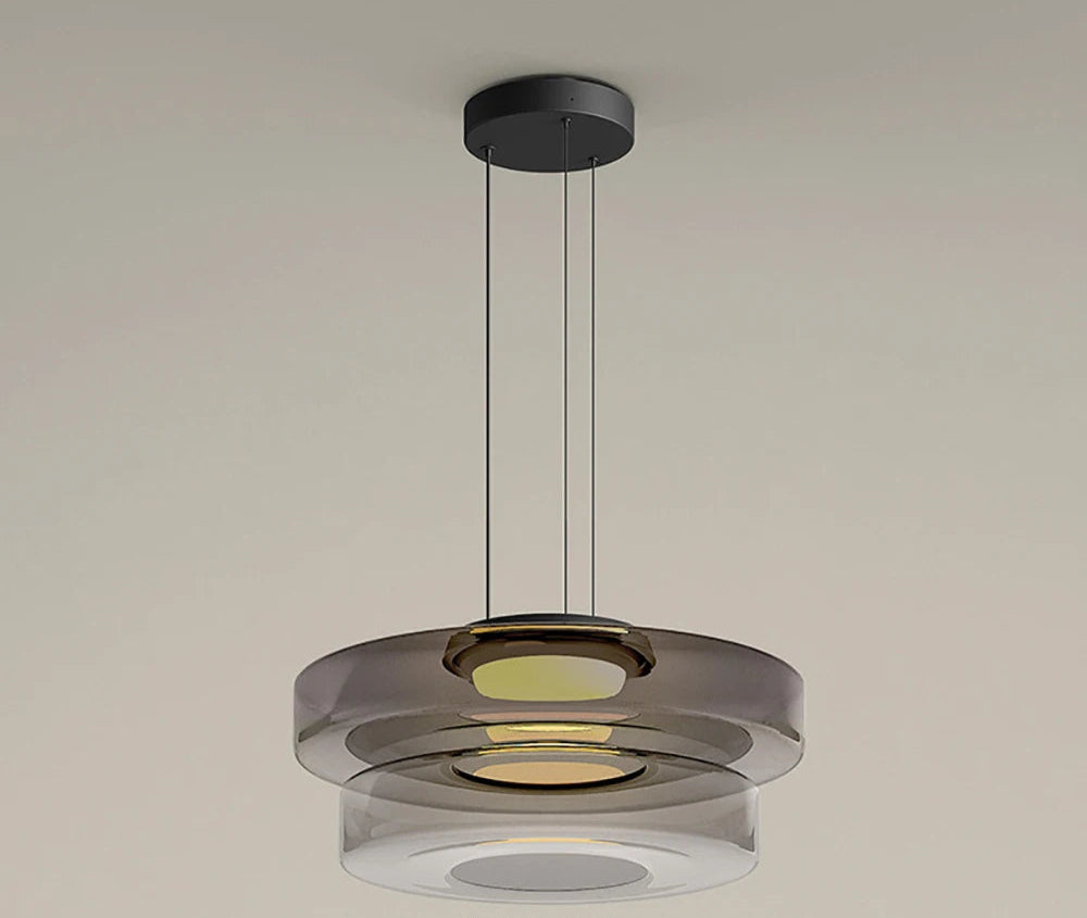 Smoke grey two-tier glass pendant light with LED source. Ideal for modern dining or kitchen lighting with a layered design.