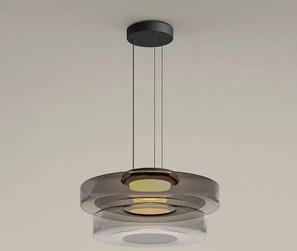 Smoke grey two-tier glass pendant light with LED source. Ideal for modern dining or kitchen lighting with a layered design.