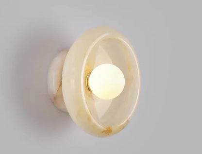 Flower Jade Wall Lamp turned on, featuring warm yellow tones and soft LED lighting for cozy and stylish interior decor.