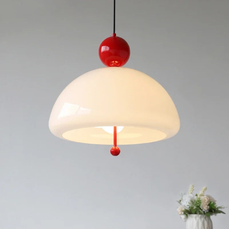 Vintage Glass Pendant Light glowing warmly with red top detail, perfect for cozy ambiance in kitchens or living rooms.
