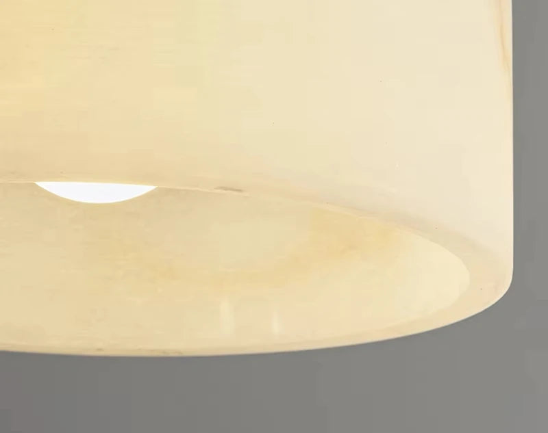 Close-up of Spanish marble lampshade, emphasizing the natural stone texture of this modern luxury chandelier.