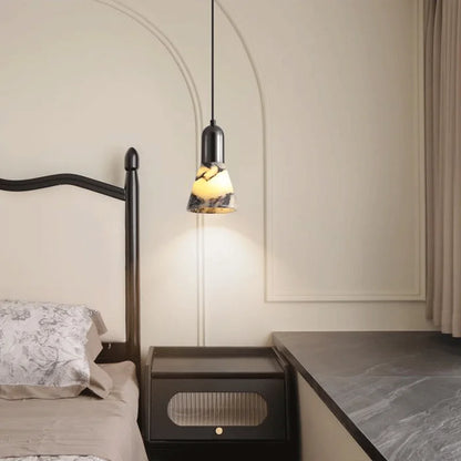 Dark Marble LED Pendant - Modern Ceiling Light mounted beside bed, blending with classic interior design and providing ambient lighting.