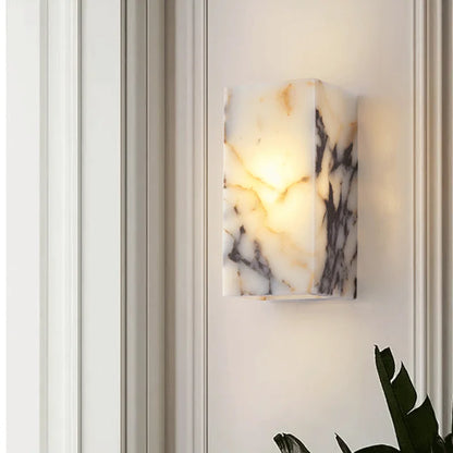 Modern black marble stone wall lamp with ambient LED light, enhancing upscale bedroom or hallway interiors.