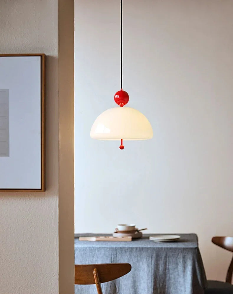 Medieval Chandelier Pendant Light with red accent illuminating a dining area, creating a cozy and vintage ambiance.