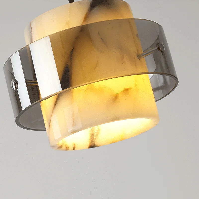 Close-up of the Luxury Stone Drop Pendant showing the glowing LED marble texture and smoked glass ring for upscale home decor.