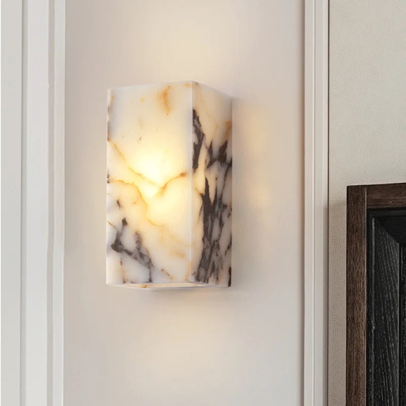 Luxury LED black marble wall sconce installed in a refined interior, ideal for bedroom or bathroom lighting.