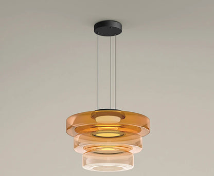 Amber three-tier glass pendant light with LED source. Features 45cm, 35cm, and 25cm diameters for a luxurious layered look.