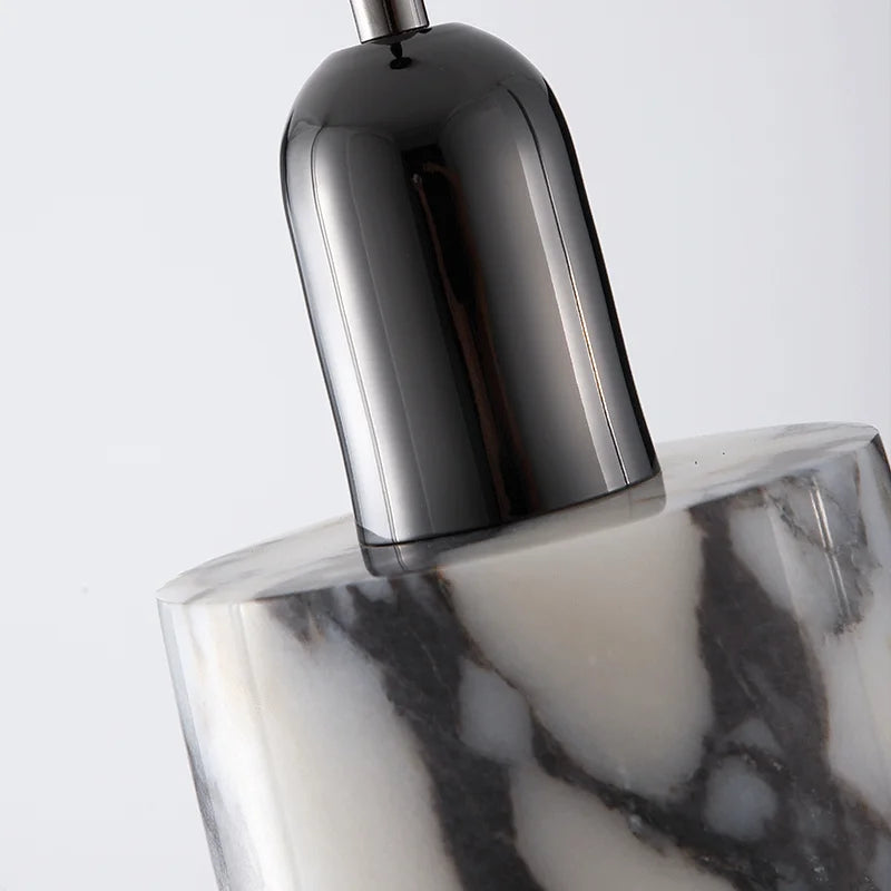 Close-up of the Black Marble Pendant Light showing detailed marble texture and glossy black fixture, highlighting premium craftsmanship.