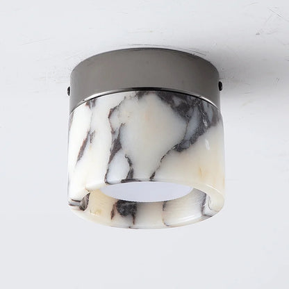 Close-up of Nordic LED wall sconce with marble-patterned glass and black metal top, perfect for hallways or modern interiors.