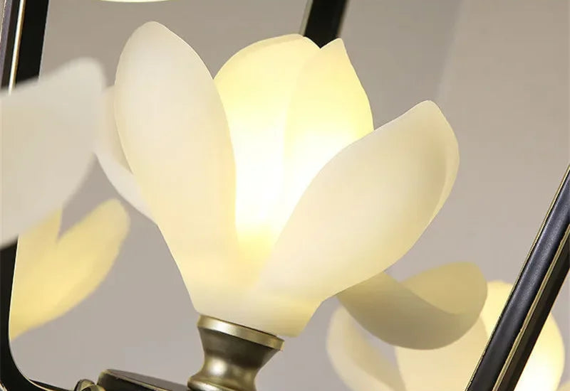 Close-up of LED flower bulb on Magnolia Pendant Light, highlighting resin petal texture and warm glow.