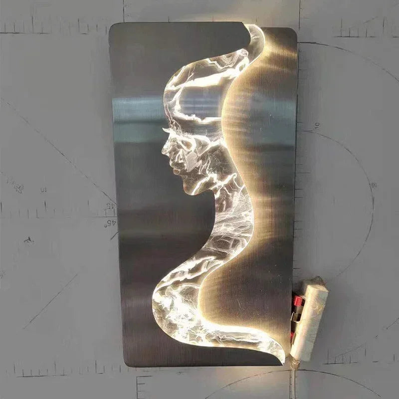 Abstract face wall sconce