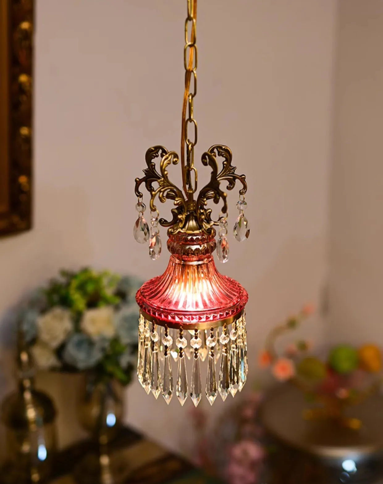 Dimmable retro French crystal chandelier with intricate gold scrollwork and hanging crystals, ideal for classic home settings.