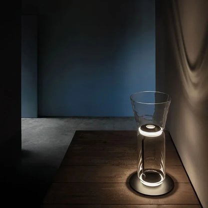 Short Italian glass floor lamp – modern minimalist nordic design with LED lighting and transparent glass, casting ambient wall light.