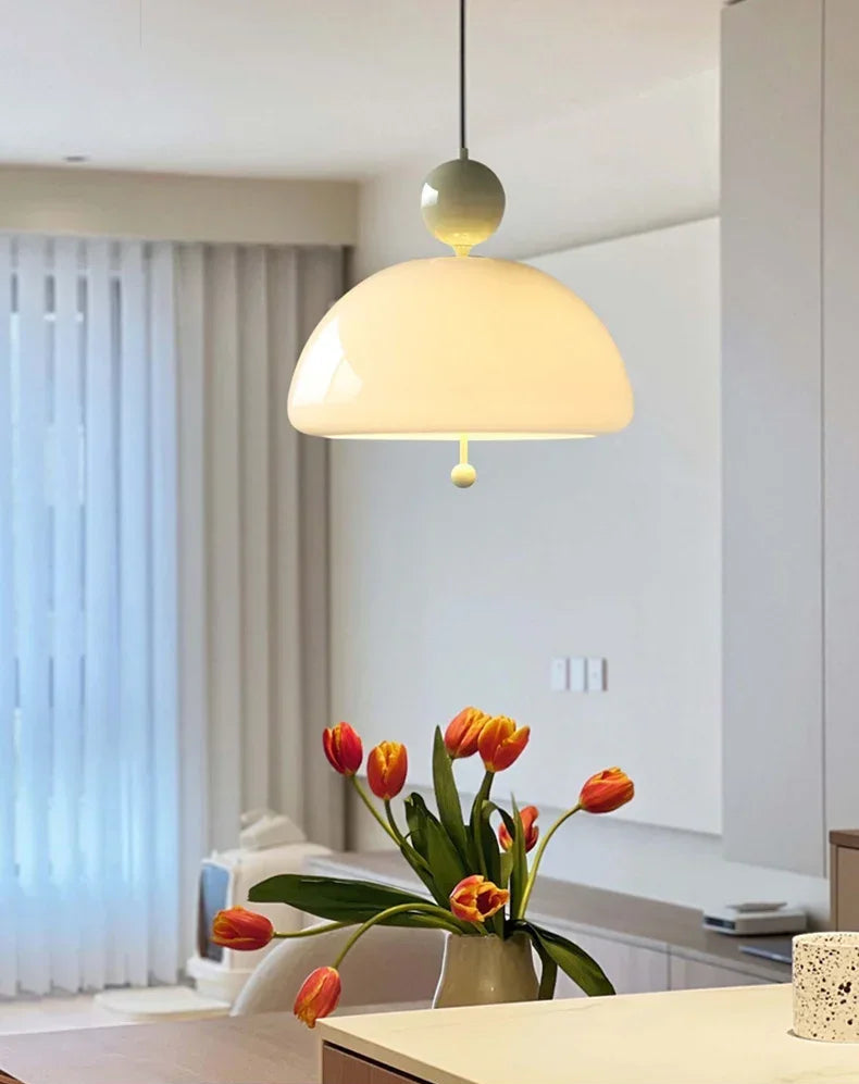 Vintage Glass Pendant Light with cream finish hanging above tulips, enhancing kitchen aesthetics with medieval elegance.