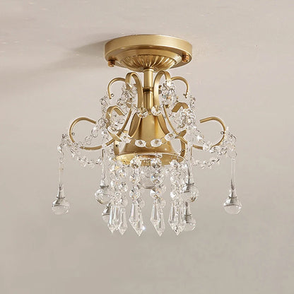 Vintage-style gold crystal chandelier lighting fixture with clear crystal accents, perfect for upscale interior decoration.
