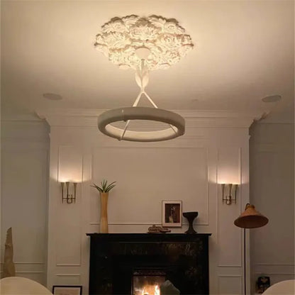 Minimalist carved plaster chandelier - french farmhouse ceiling light with circular LED ring, enhancing cozy living room ambiance.