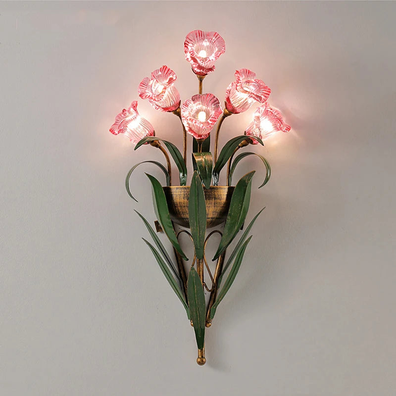 Pink flower French country wall sconce with green leaves, perfect for vintage-inspired bedrooms or garden-themed interiors.