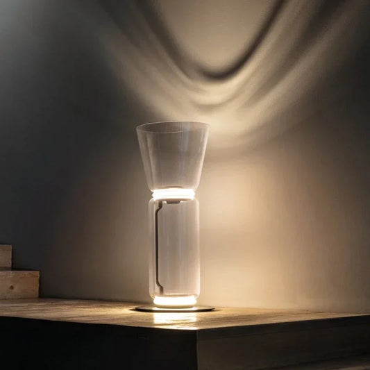Italian glass floor lamp – modern minimalist nordic design with LED lighting, featuring a clear glass body and soft wall-reflected glow.