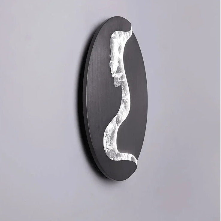 Abstract face wall sconce