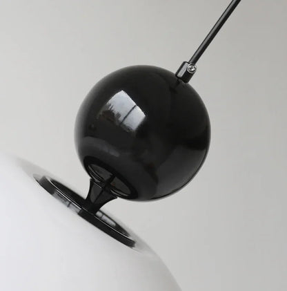 Detailed view of black spherical top on the Medieval Chandelier Pendant Light, emphasizing its retro-modern aesthetic.