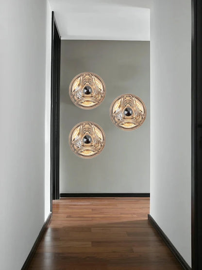 Modern hallway featuring three designer glass wall lamps with LED lights, perfect for stylish home or shop decor.