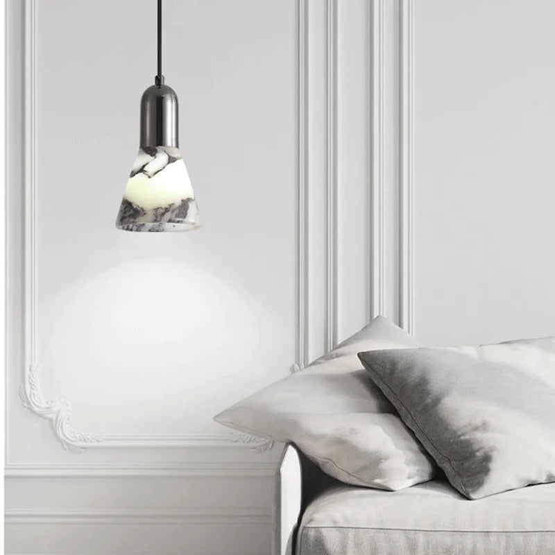 Dark Marble LED Pendant - Modern Ceiling Light hanging in a minimalist living space, showcasing its elegant marble finish and soft LED glow.