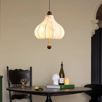 Modern Art Hanging Lamp with tulip-shaped cloth shade and wood detailing, a Nordic pendant light for cozy dining spaces.