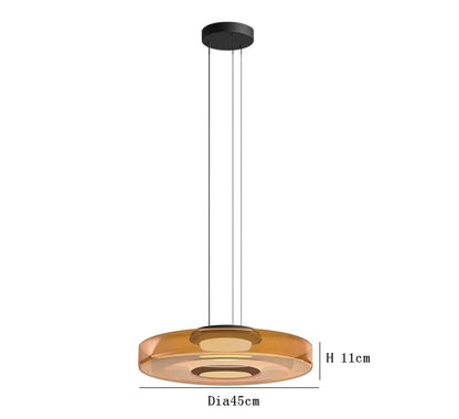 Amber glass pendant light with 45cm diameter and 11cm height. LED lighting and adjustable hanging for luxury interiors.