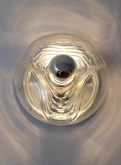 Overhead view of modern LED wall lamp with clear glass design, perfect for stylish home or restaurant lighting.