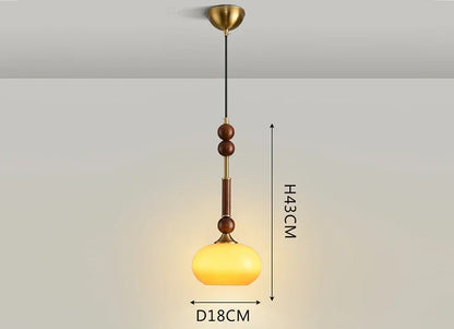 Modern Art Hanging Lamp with amber glass globe and wood stem, a Nordic pendant light for warm ambient lighting.