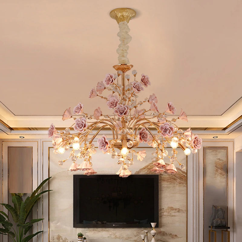 Luxury Rose Crystal Chandelier featuring LED bulbs and ornate pink roses, perfect for upscale living room or entertainment area lighting.