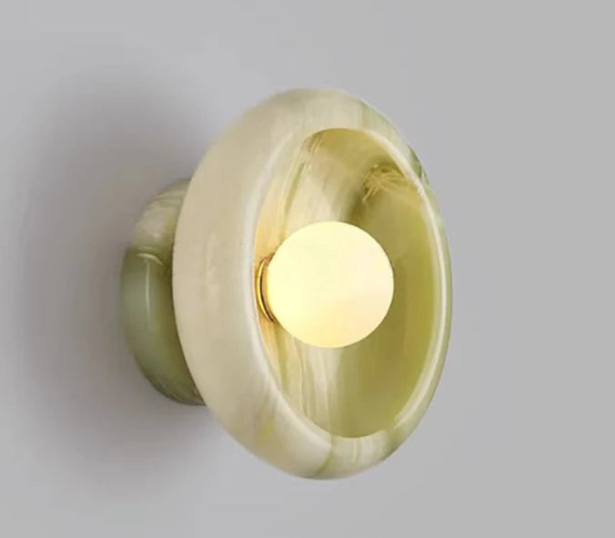 Sapphire green Jade Wall Lamp turned on, offering ambient LED lighting and luxury green accent for bedroom or living room walls.