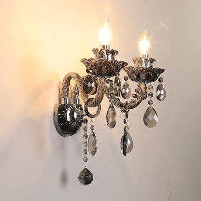 Side view of vintage lotus crystal wall lamp in dark chrome finish with LED bulbs and hanging crystals, ideal for home interiors.