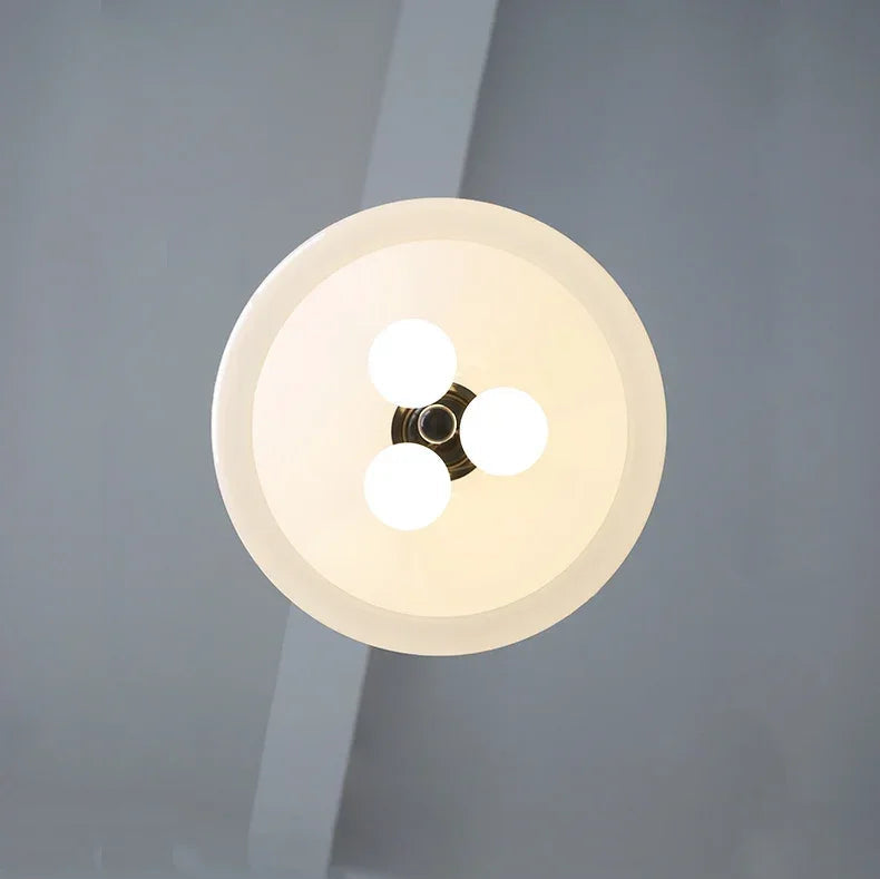 Bottom view of illuminated Medieval Chandelier Pendant Light showing three-bulb configuration for even light distribution.