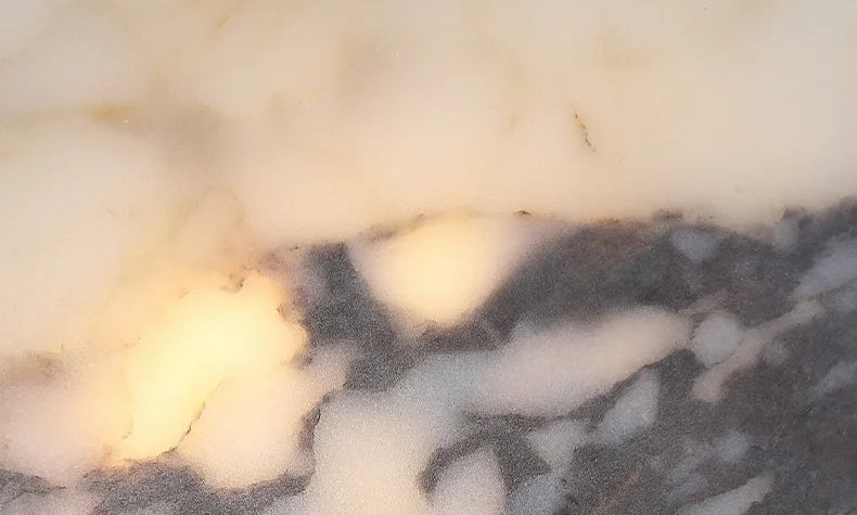 Detailed view of the marble texture on the Black Marble Pendant Light, showcasing the natural stone pattern and LED glow.