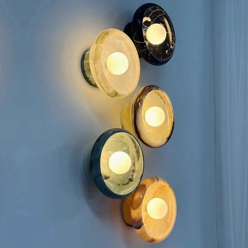 Assorted Jade Wall Lamps in multiple colors including green, black, and cream, mounted on a wall for ambient bedroom or living room lighting.